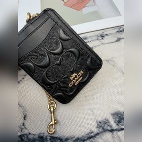 Черный кошелек Coach с металлической ц