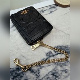 Черный кошелек Coach с металлической ц