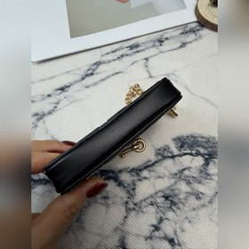Черный кошелек Coach с металлической ц