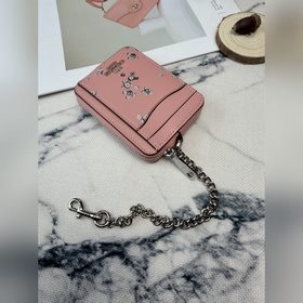 Этот розово-серебристый кошелек Coach 