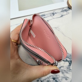 Этот розово-серебристый кошелек Coach 