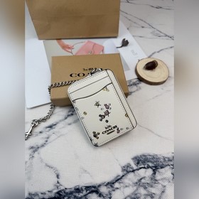 Этот блестящий кошелек Coach с разнооб