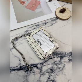 Этот блестящий кошелек Coach с разнооб