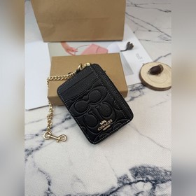 Черный кошелек Coach с металлической ц