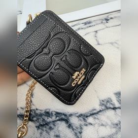 Черный кошелек Coach с металлической ц