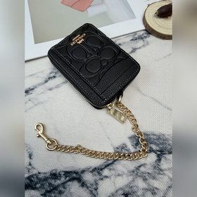 Черный кошелек Coach с металлической ц