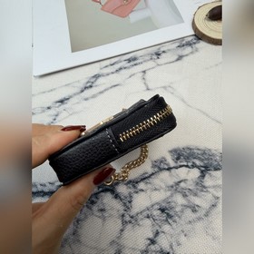 Черный кошелек Coach с металлической ц