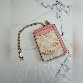 Розовый кошелек Coach с цветочным узор
