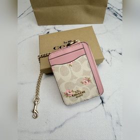 Розовый кошелек Coach с цветочным узор