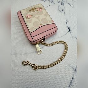 Розовый кошелек Coach с цветочным узор