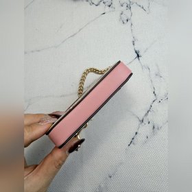 Розовый кошелек Coach с цветочным узор
