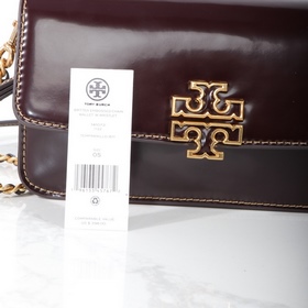 Tory Burch, сумочка-клатч Britten с це