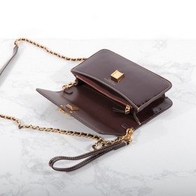 Tory Burch, сумочка-клатч Britten с це