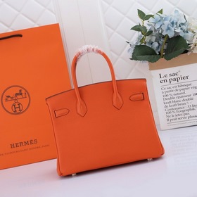 Сумка Birkin от Hermès, оранжевая, золотая и серебряная застежка,