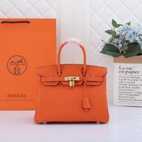Сумка Birkin от Hermès, оранжевая, золотая и серебряная застежка,