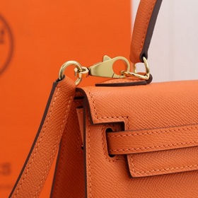 Сумка Hermes Kelly через плечо, оранжевая с золотыми серебряными 