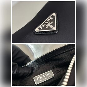 Prada Треугольная сумка через плечо Артикул： 1BH0 Этот треугольн